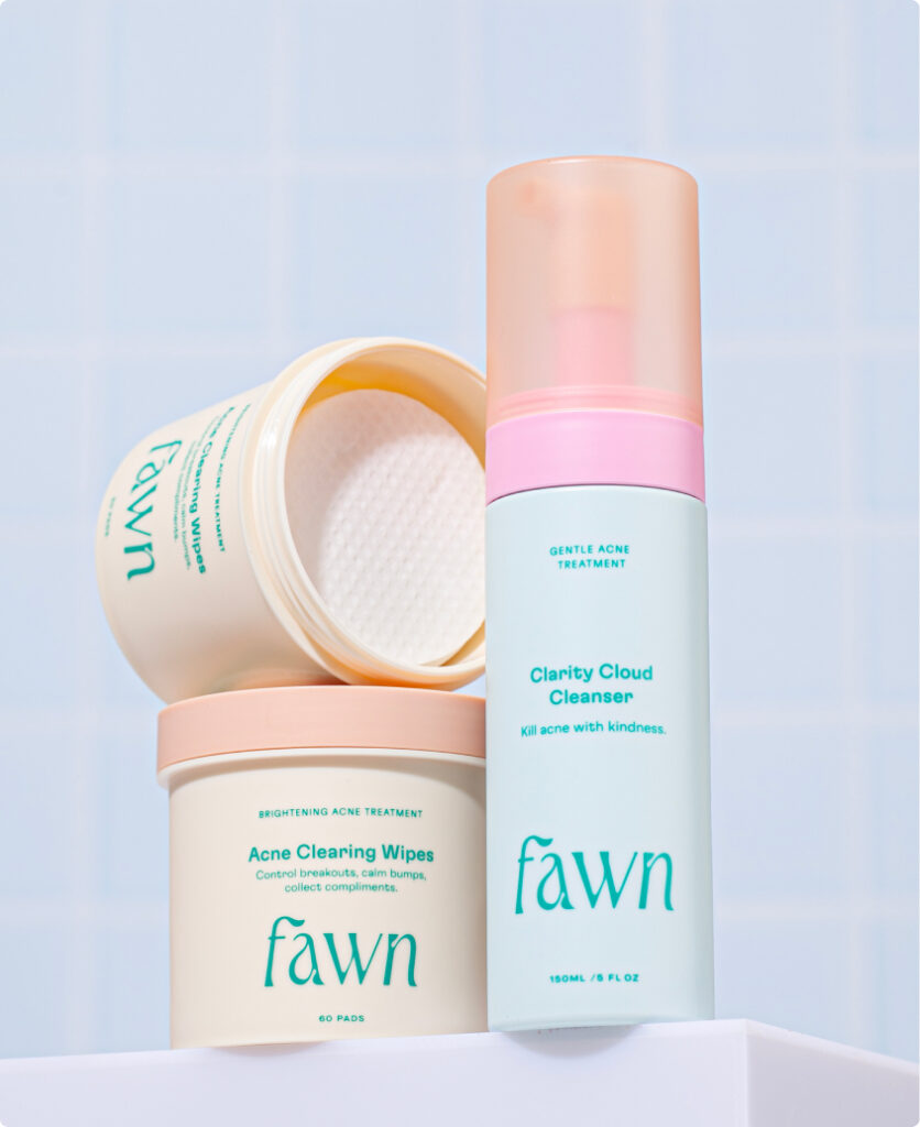 Fawn acne wipes and Fawn Clarity Cloud Cleanser on a light blue background.